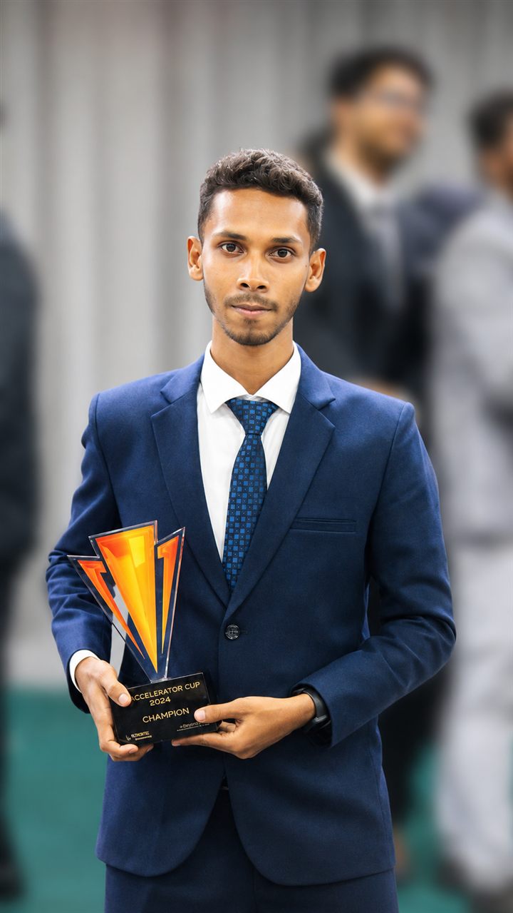 Shahriar Hossain holding the Accelerator Cup 2023 Champion trophy