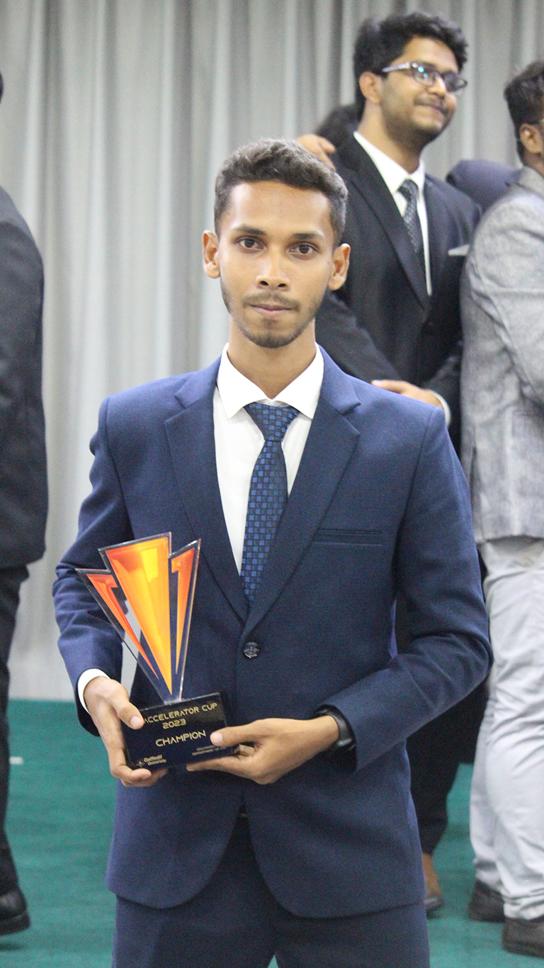 Shahriar holding Accelerator Cup 2023 Champion trophy