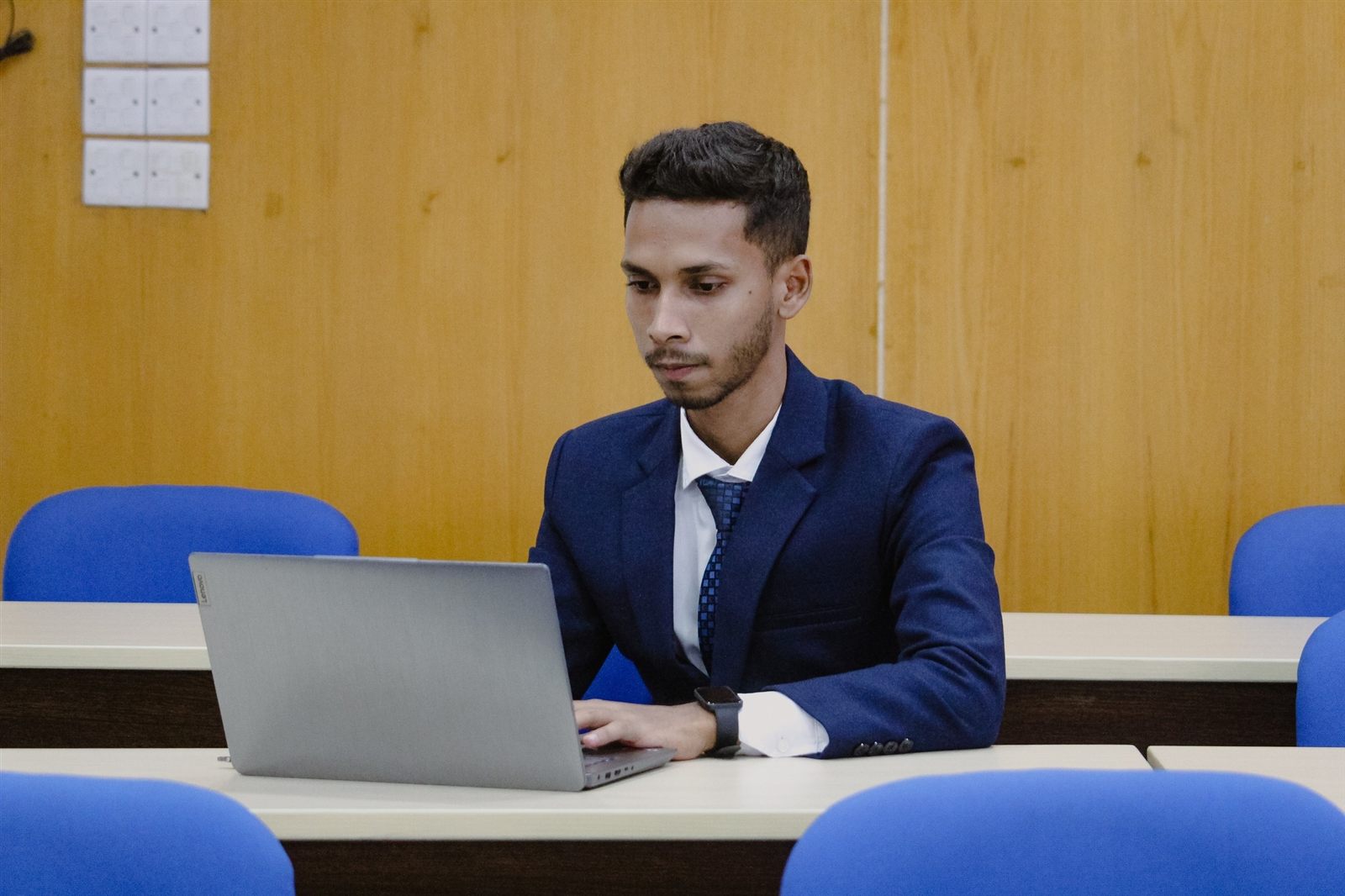 Shahriar Hossain working on a laptop