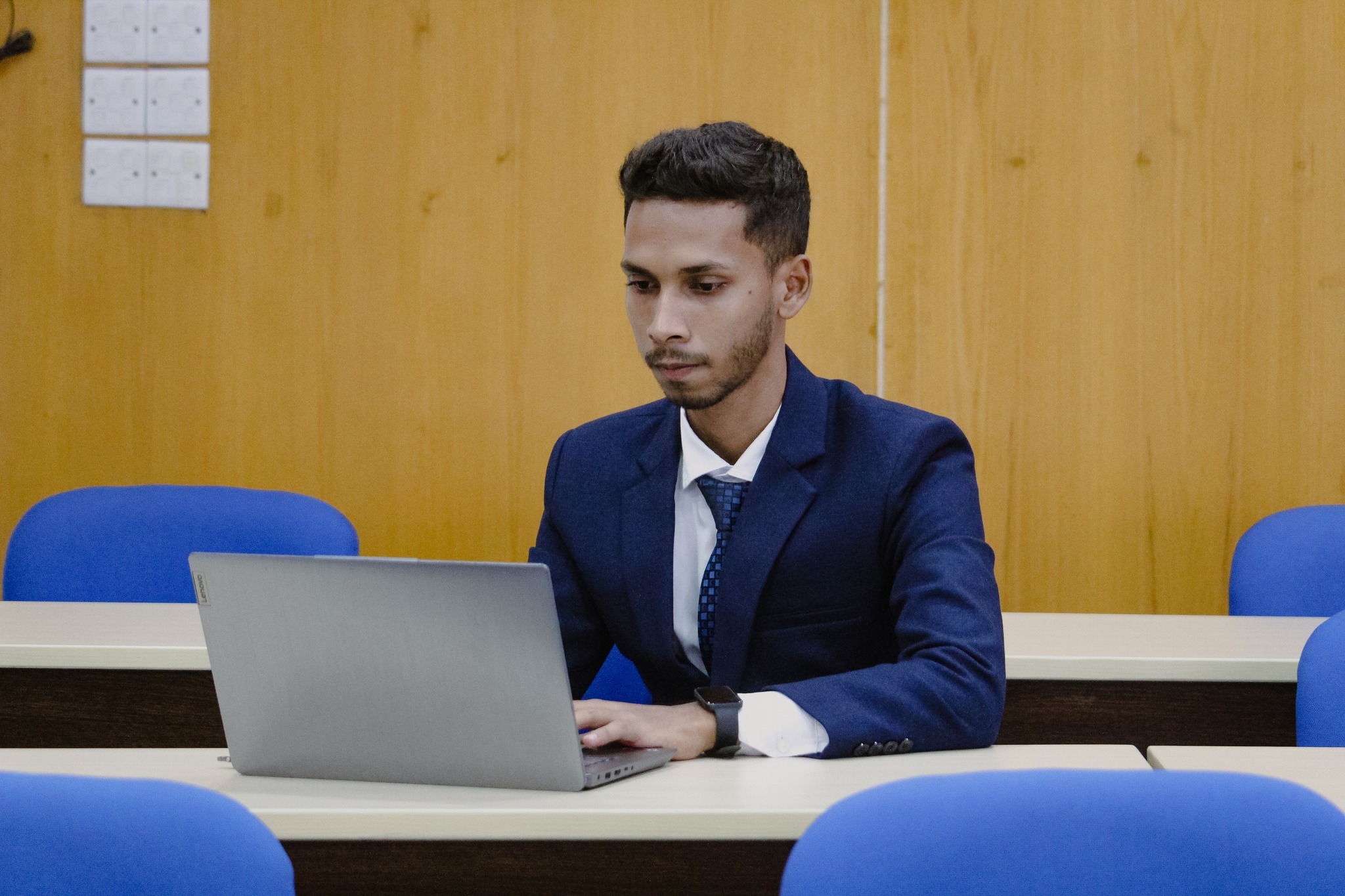 Shahriar Hossain working on a laptop
